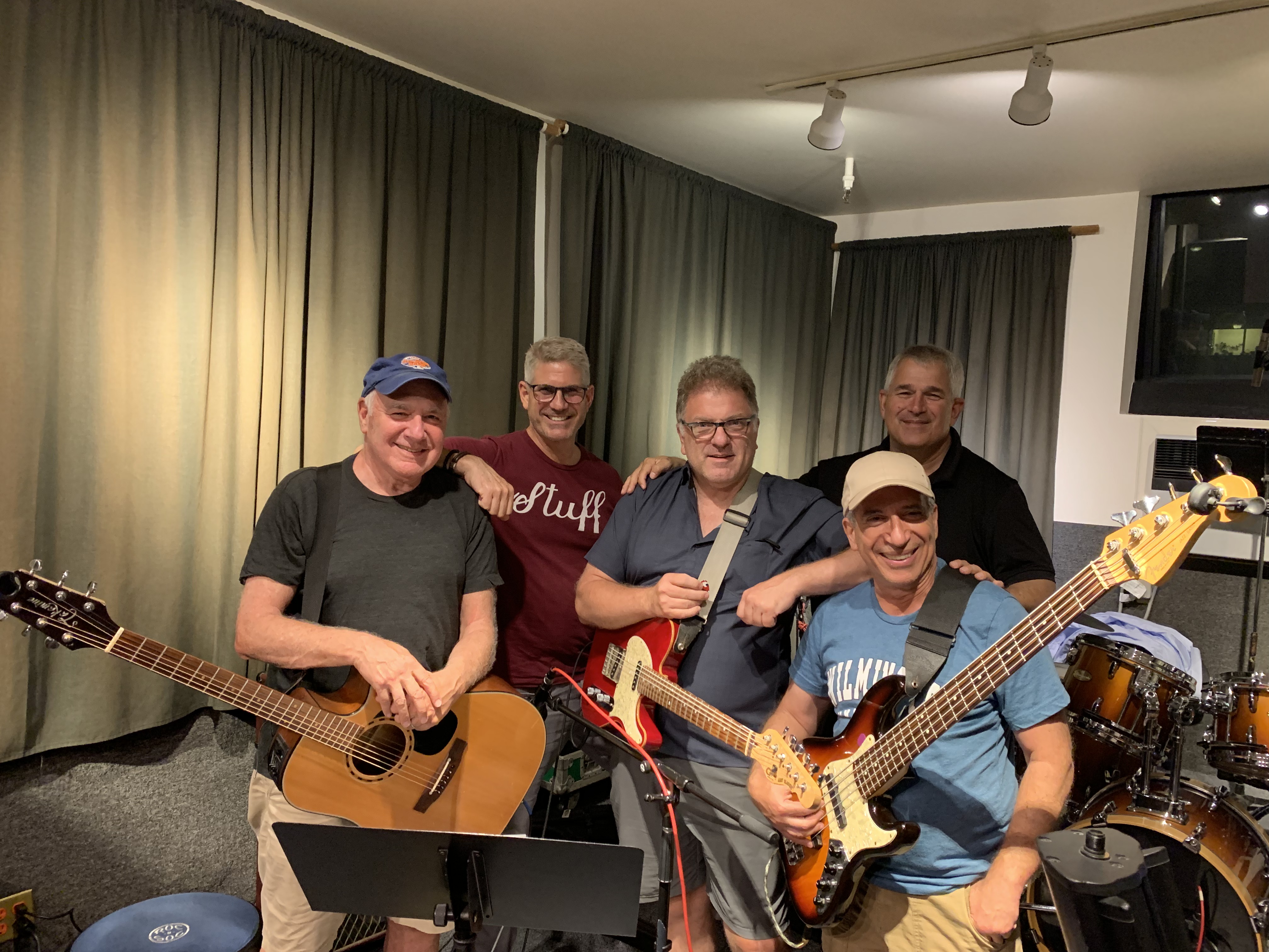 The members of Loaded together in the rehearsal studio